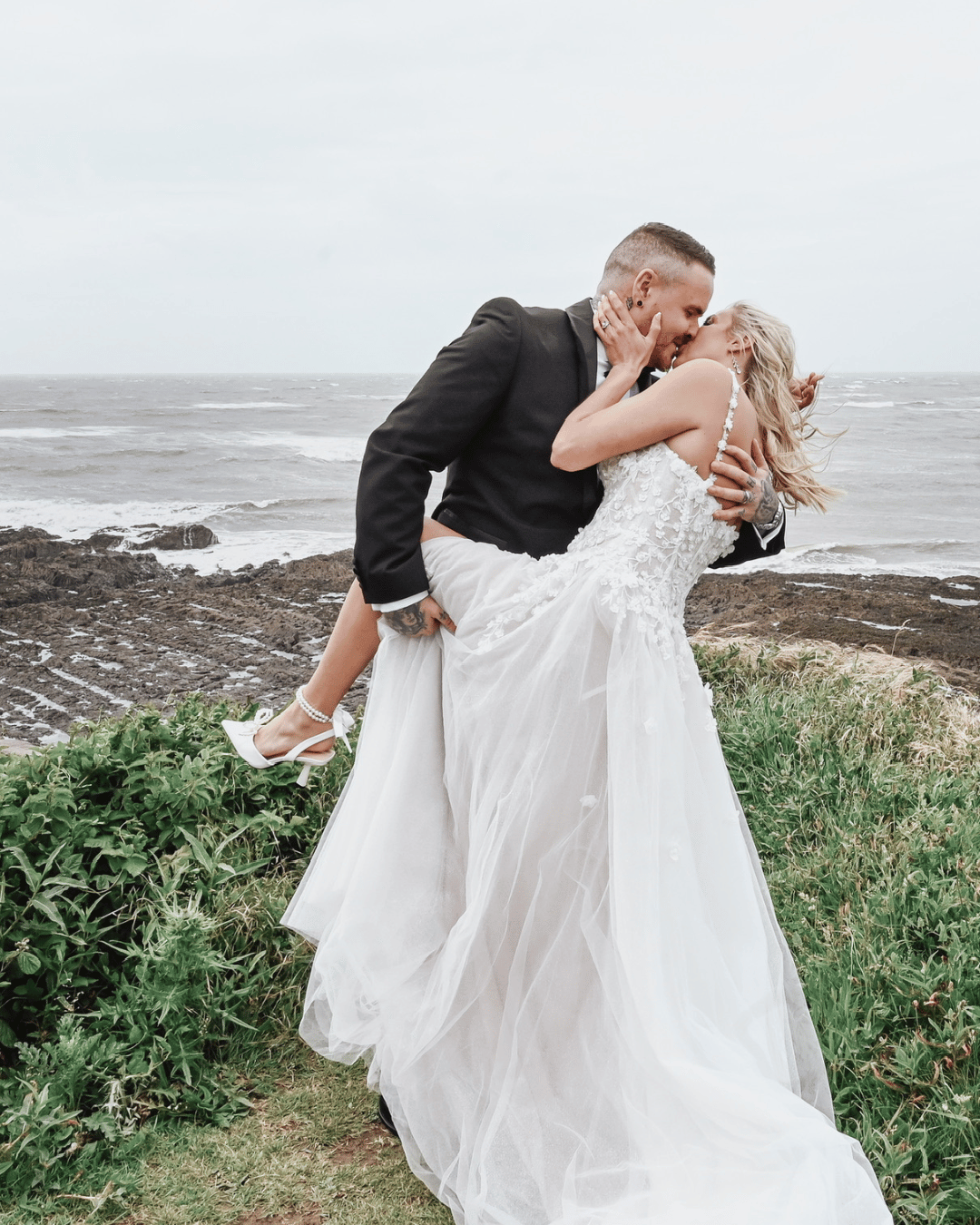 Bride and Groom on the beach kissing